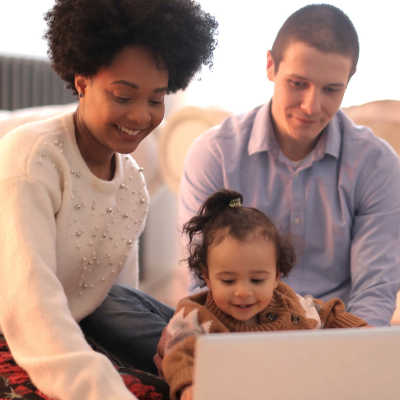 Happy family using laptop